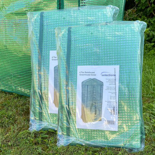 Two packaged 4-tier mini greenhouse replacement covers in green color, displayed outdoors.