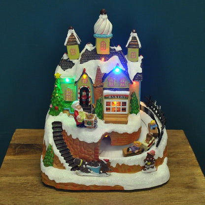 Christmas Village Bakery Scene Ornament with Lights Moving Children's Train and Sound