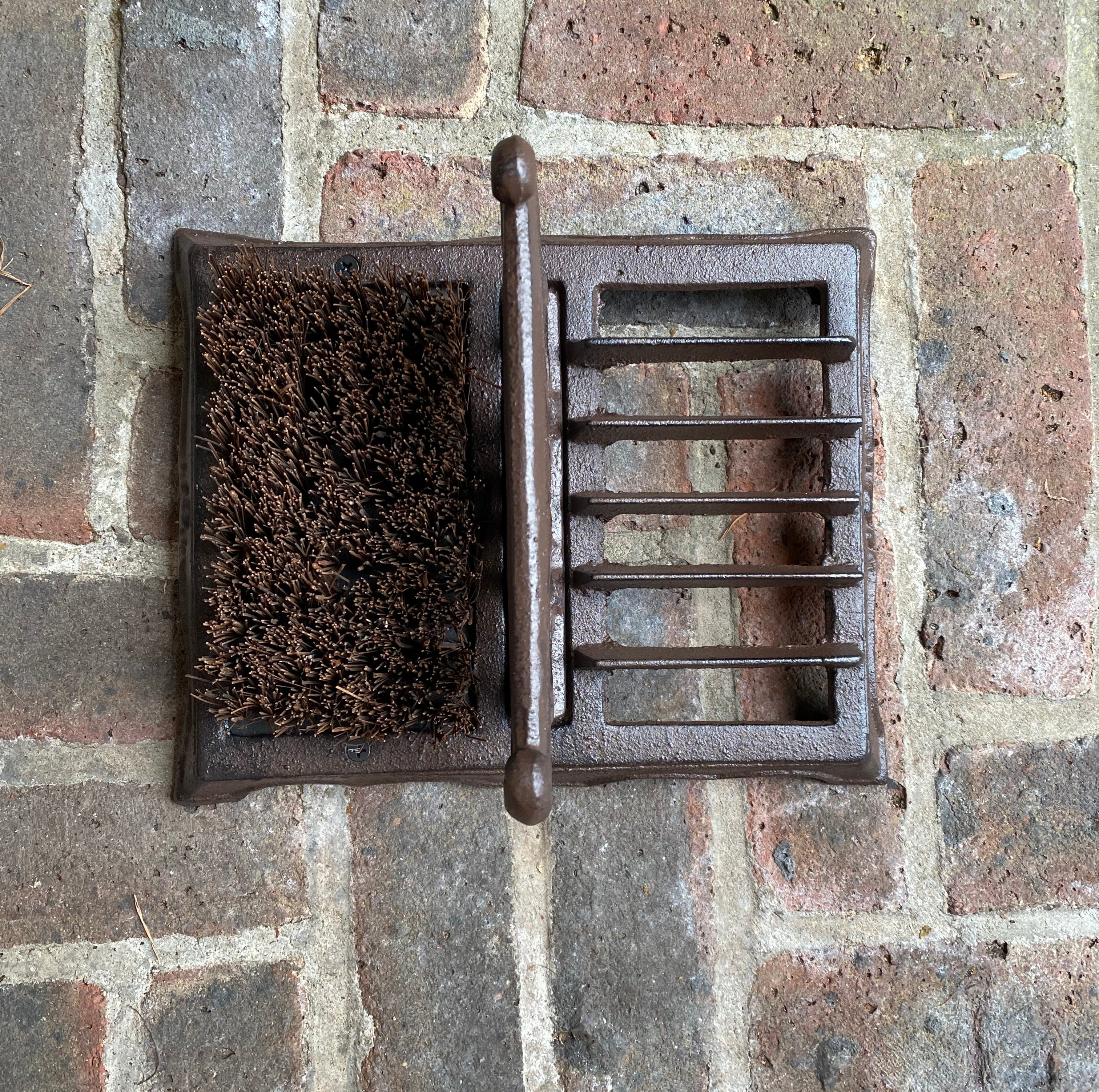 Boot scraper in outlet wall